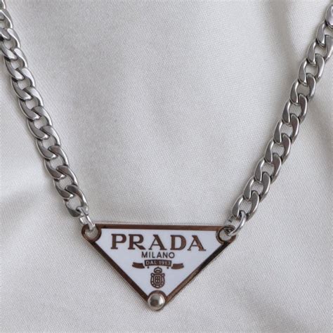 white prada|white Prada necklace.